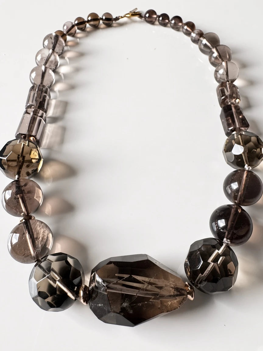 Hue La La Gems statement necklace featuring smoky quartz beads in taupe and charcoal with a gold-tone toggle clasp.