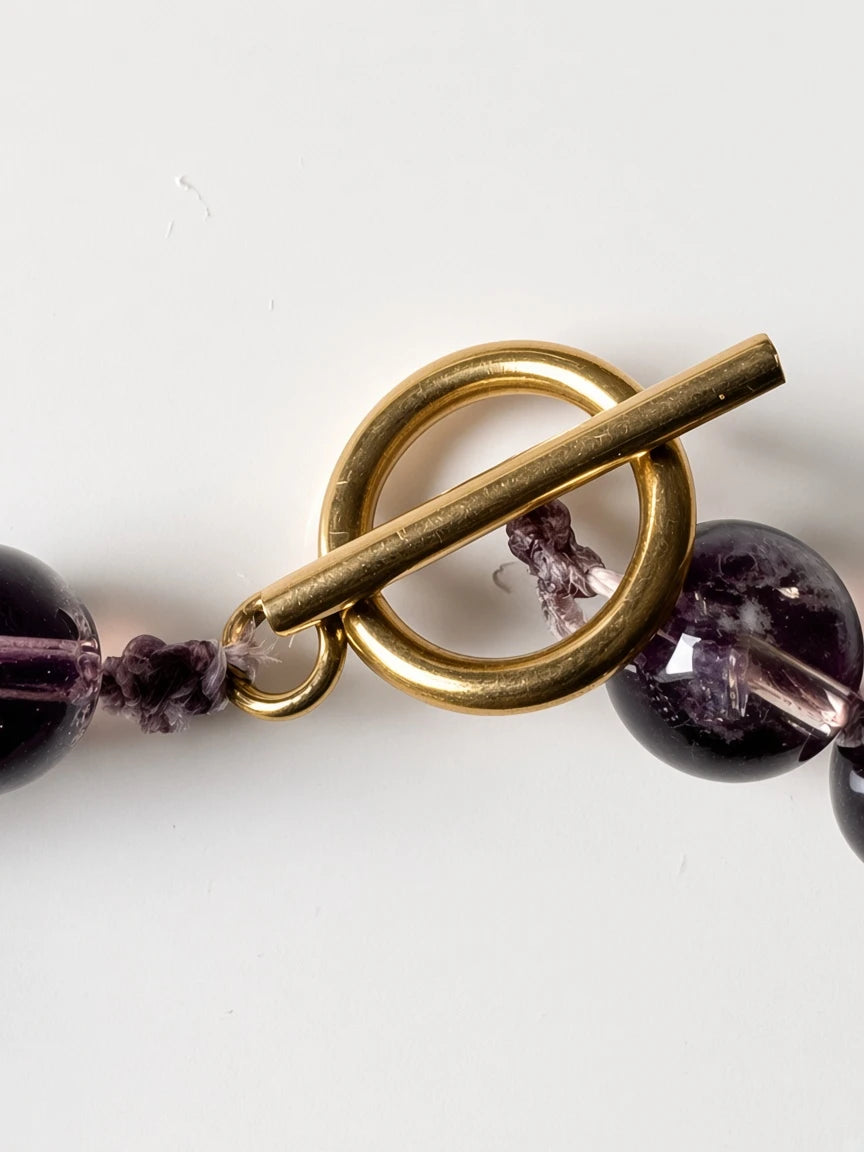 Hue La La Gems smoky quartz beaded necklace featuring a polished gold-tone toggle clasp on a white background