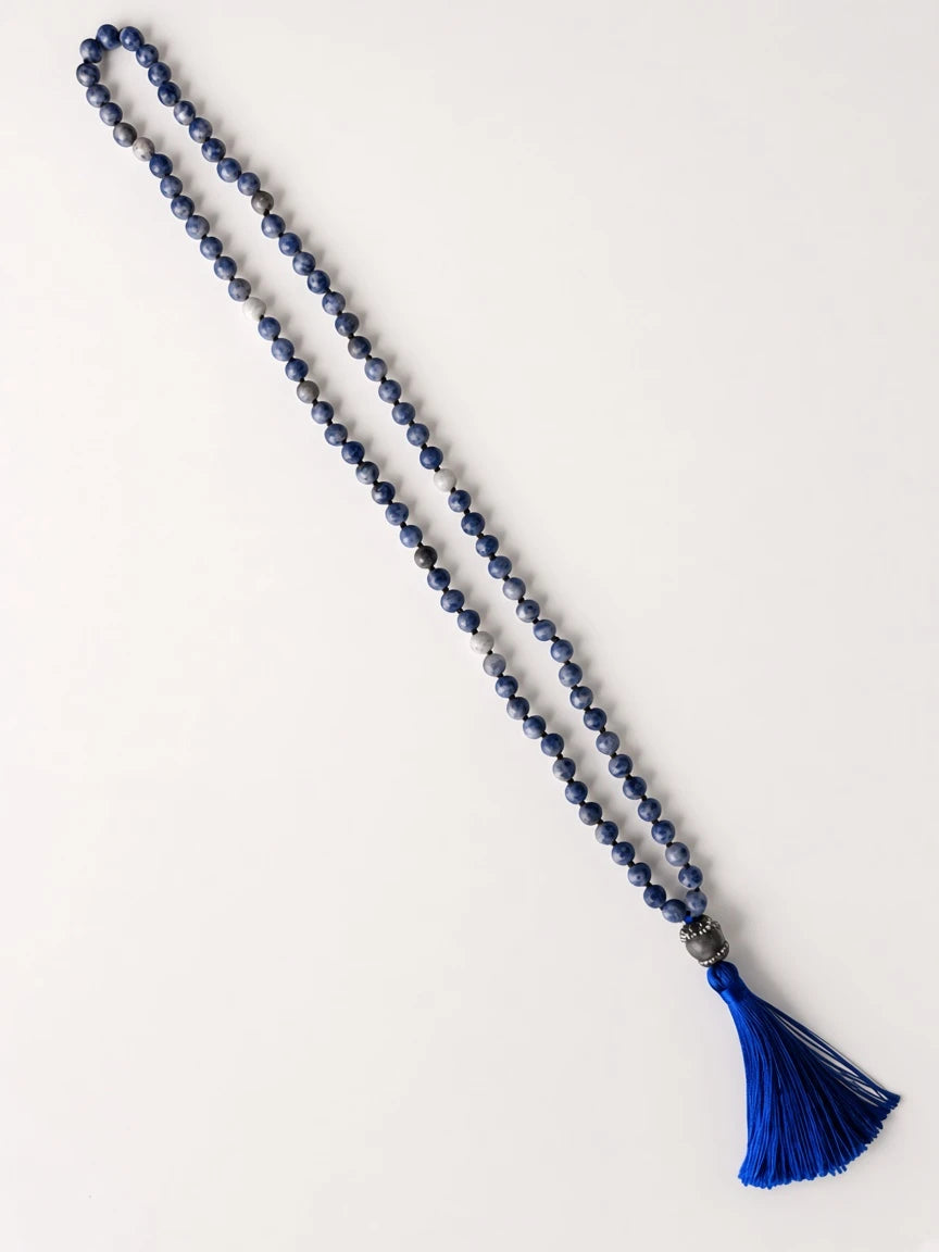 Hue La La Gems handcrafted sodalite mala necklace with deep blue beads, textured focal bead, and royal blue tassel.