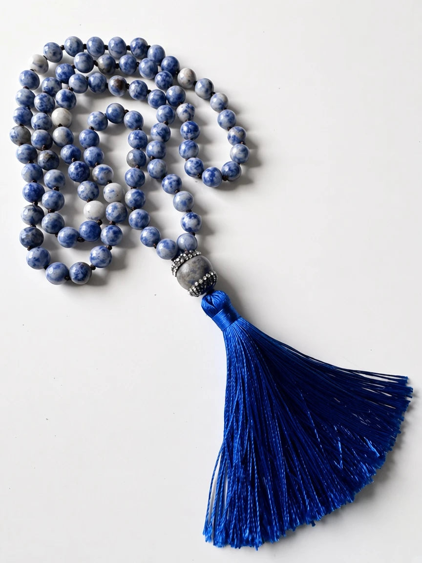 Hue La La Gems handcrafted mala necklace featuring blue and white sodalite beads and a vibrant royal blue silk tassel.