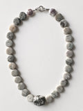 Hue La La Gems handcrafted stone bead necklace with grey and green circular beads and a faceted focal stone clasp
