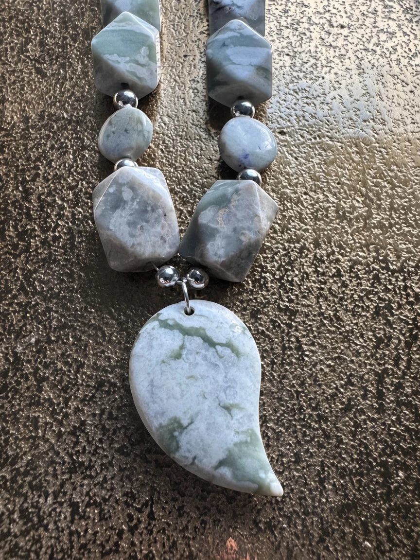 Hue La La Gems handcrafted statement necklace with sage, grey, and cream stone beads and a teardrop focal pendant.