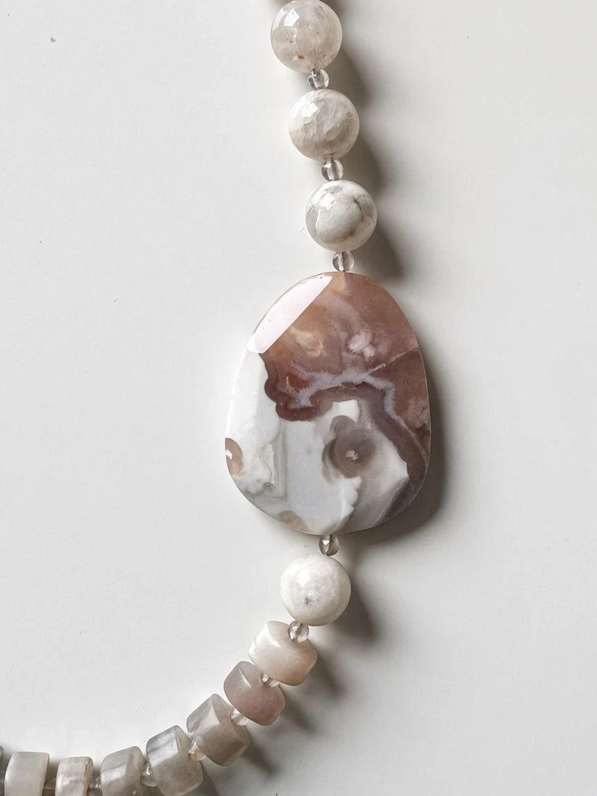 Hue La La Gems handcrafted statement necklace featuring a large polished mocha and cream stone focal bead with accents.