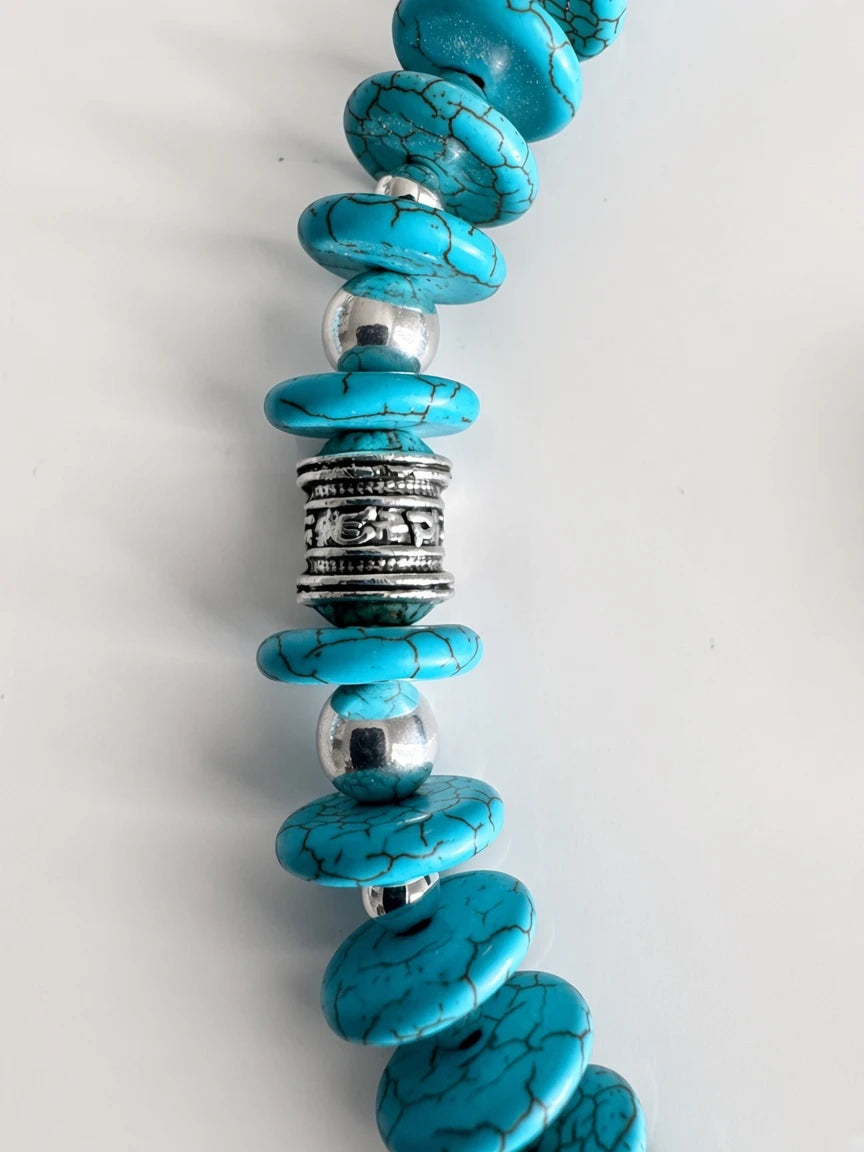 Hue La La Gems turquoise-style beaded necklace with blue disc beads, black veining, and ornate silver-tone spacers