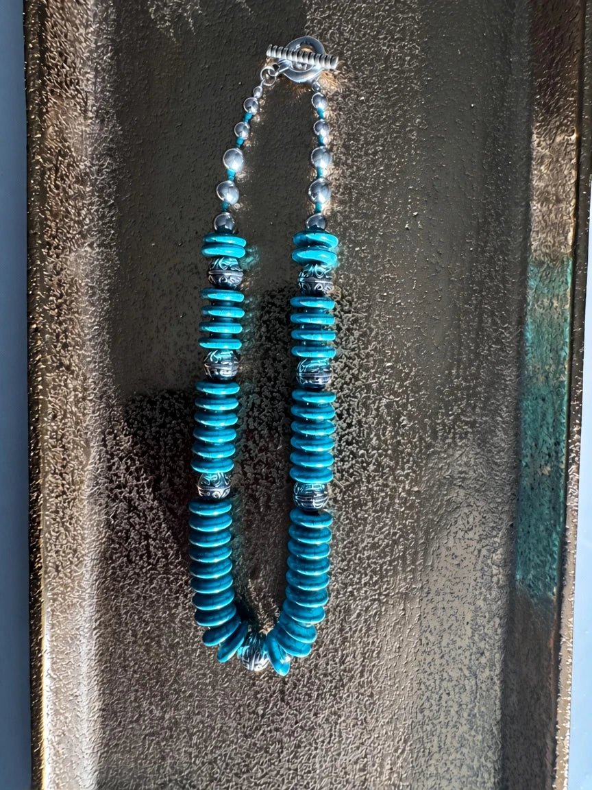 Hue La La Gems turquoise disc beaded statement necklace with intricate silver-toned metal spacer beads and toggle clasp
