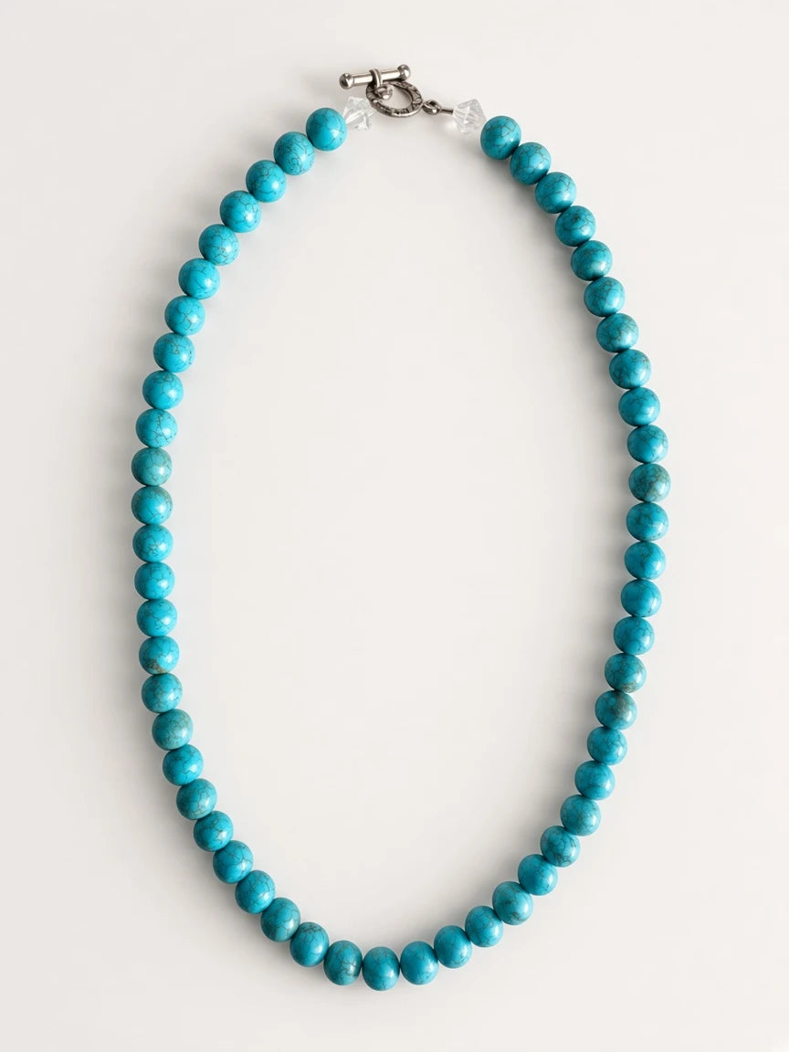 Hue La La Gems turquoise beaded statement necklace with clear crystal accents and an engraved silver-tone toggle clasp.