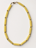 Hue La La Gems yellow matte cylinder bead necklace with gold-tone spacers and a lobster clasp on a white background.